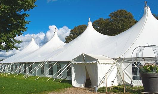 a line of sleek and modern portable restrooms ready for use at an upscale corporate event in Byron